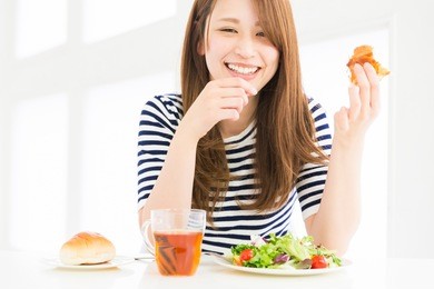 young attractive asian woman who eats