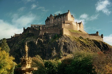 edinburgh castle with fountain as the famous city landmark. united kingdom.