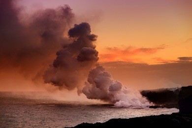 lava pouring into the ocean creating a huge poisonous plume of smoke at hawaii's kilauea volcano, volcanoes national park, big island of hawaii