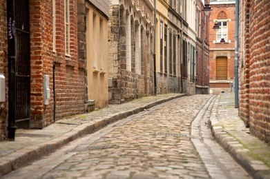 little old cobblestone street in lille, france