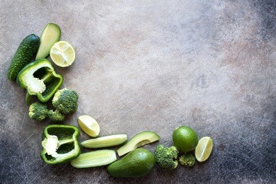 frame from fresh green vegetables flat lay with free space for text