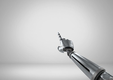 digital composite of android robot hand pointing with grey background