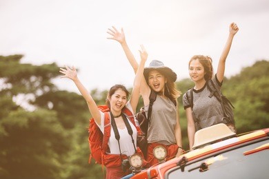 friends group having fun together tourists with backpacks in forest