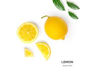creative layout made of lemon and leaves. flat lay. food concept. lemon on white background.