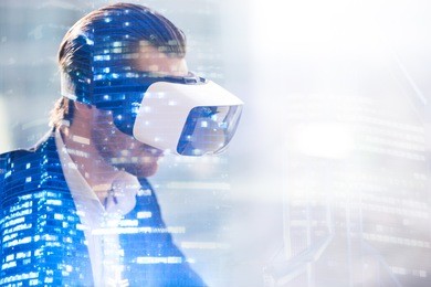 close up image of man in virtual reality glasses. guy wearing vr headset working in digital simulation, entertains in cyberspace. looking on augmented reality double exposure concept with copy space