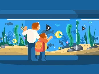 dad with son in oceanarium