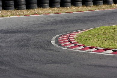 an empty bend on a race car circuit.