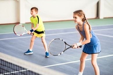 happy children playing sport game on court