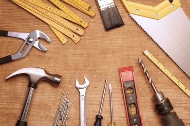 assorted work tools on wood