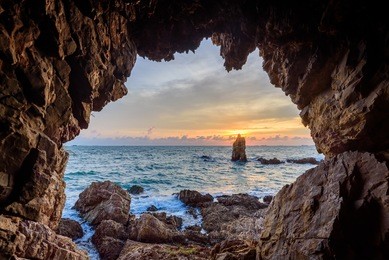 the cave with beautiful sunset view of the sea