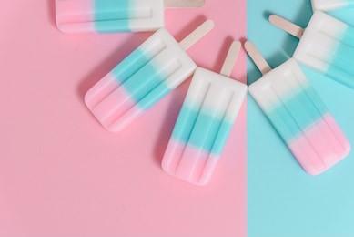 ice cream sticks on pastel colors background