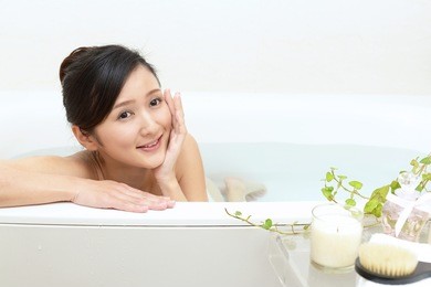 young beautiful woman taking relaxing bath