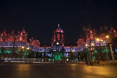 chhattrapati chivaji terminus illuminated with multicolored lights in the evening for india independence day with light trail of traffic circa august 2015