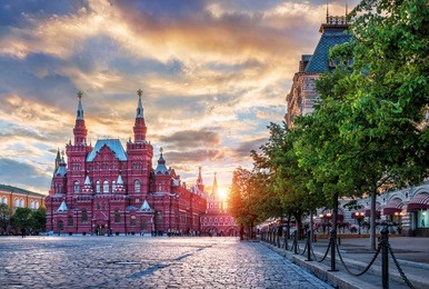 the historical museum on red square in moscow on a summer sunset evening and the setting sun