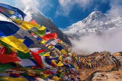 prayer flags and mt. annapurna i background from annapurna base camp ,nepal.