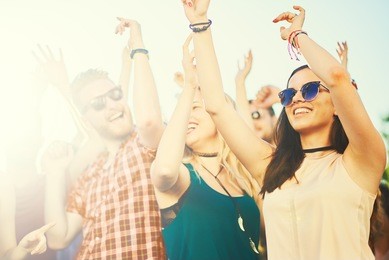 big group of people dancing at outdoor festival
