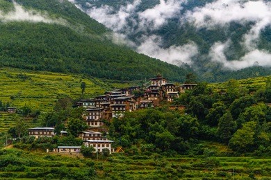 scenery near the punakha dzong temple (pungthang dechen phodrang dzong - palace of great happiness), bhutan. bhutanese village near the river at punakha, bhutan