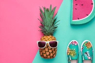 fashion. pineapple hipster in sunglasses, stylish sneakers, handbag. minimal concept, summer accessories, tropical pineapple. creative art fashionable concept, summertime
