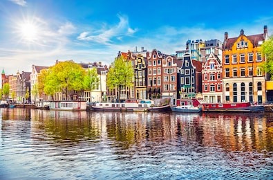 amsterdam netherlands dancing houses over river amstel landmark in old european city spring landscape.