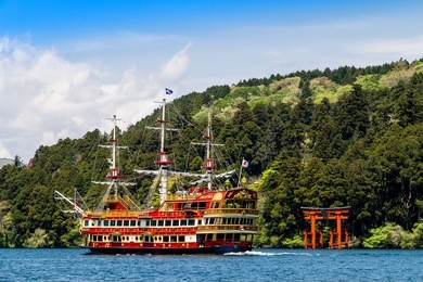 torii on the water with pirate ship in lake ashi ashinoko hakone japan