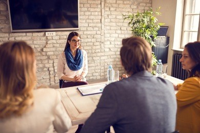 young female on job interview with commission