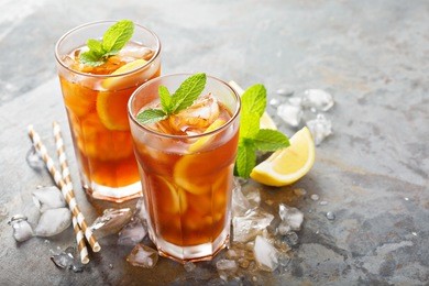 traditional iced tea with lemon and ice in tall glasses