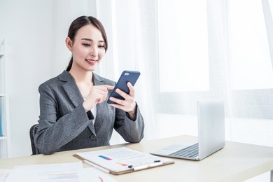 close up portrait of cheerful handsome girl in glasses talking on mobile phone. communication concept