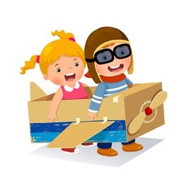 creative boy playing as a pilot with cardboard airplane