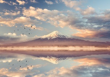 mount fuji san at lake kawaguchiko in japan. mt.fuji reflection on sunrise. vintage tone 