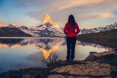 girl admiring the swiss alps and matterhorn peak in the background, zermatt, stellisee, switserland