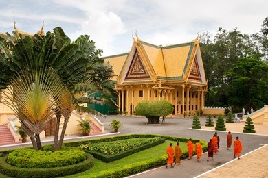 monks tour the royal palace grounds in phnom penh, cambodia
