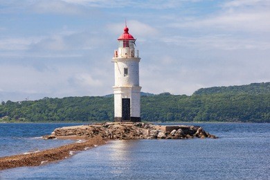lighthouse tokarevskiy egersheld on tokarevskaya koshka cape in vladivostok, primorsky krai in russia