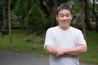 happy healthy smiling senior or middle aged man, well-being or healthy lifestyle concept