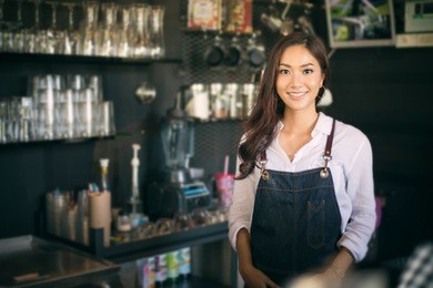 asian women barista smiling and using coffee machine in coffee shop counter - working woman small business owner food and drink cafe concept