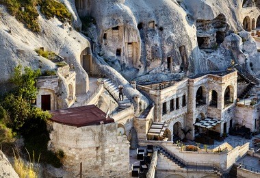 hotel boutique in the tufa mountains at sunset in goreme city, cappadocia, turkey