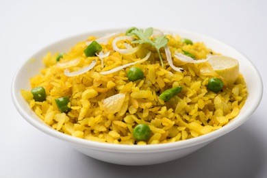 dish poha also know as pohe or aalu poha made up of beaten rice