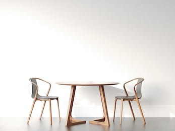 two chairs and table in bright modern interior with white wall. 3d rendering