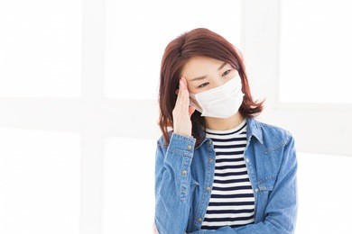 young attractive asian woman who wore a mask