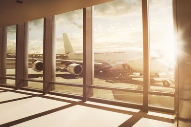 airplane stands at airport gate