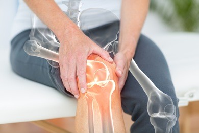 digitally generated image of man suffering with knee pain 