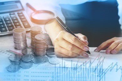 double exposure working woman analyzing on business graph with coin,saving account, calculator in background 