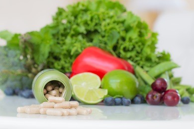 vitamins supplements in bottle on marble table.