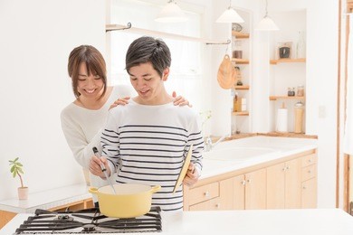 young asian couple in kitchen