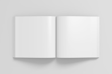 blank pages of open square soft cover book with glossy paper. isolated  on white background with clipping path around book. 3d illustration.