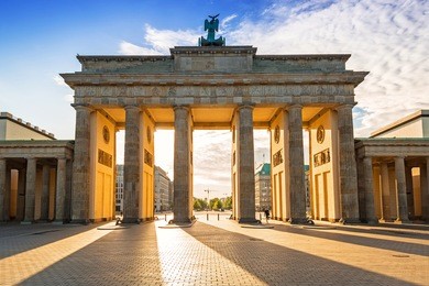 the brandenburg gate in berlin at sunrise, germany