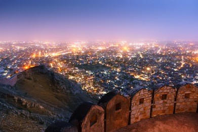 fortifications at the nahargarh fort with a beautiful view of jaipur from the mountaintop. this is a popular tourist destination