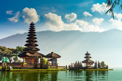 a beautiful sunrise at a lake bratan with ulundanu temple / pura ulun danu bratan, hindu temple on bratan lake landscape, one of famous tourist attraction / bali, indonesia