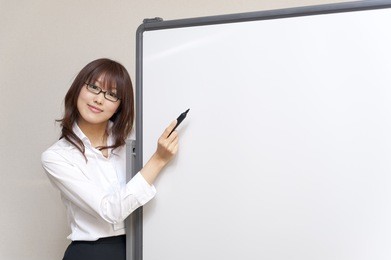 a portrait of young business woman and blank white board