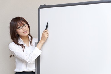 a portrait of young business woman and blank white board