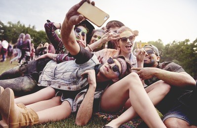 friends making selfie at the summer festival